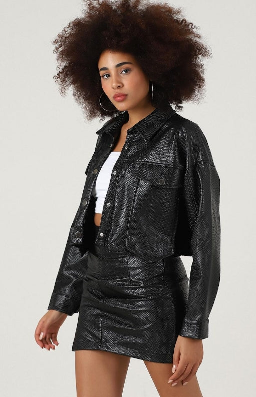 A two-piece faux leather set with mini skirt and jacket